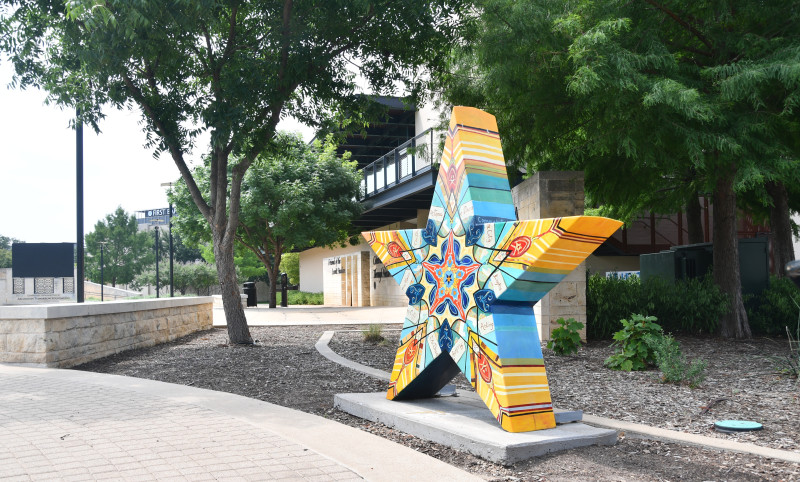 Image of art installation, a star sculpture that is hand painted