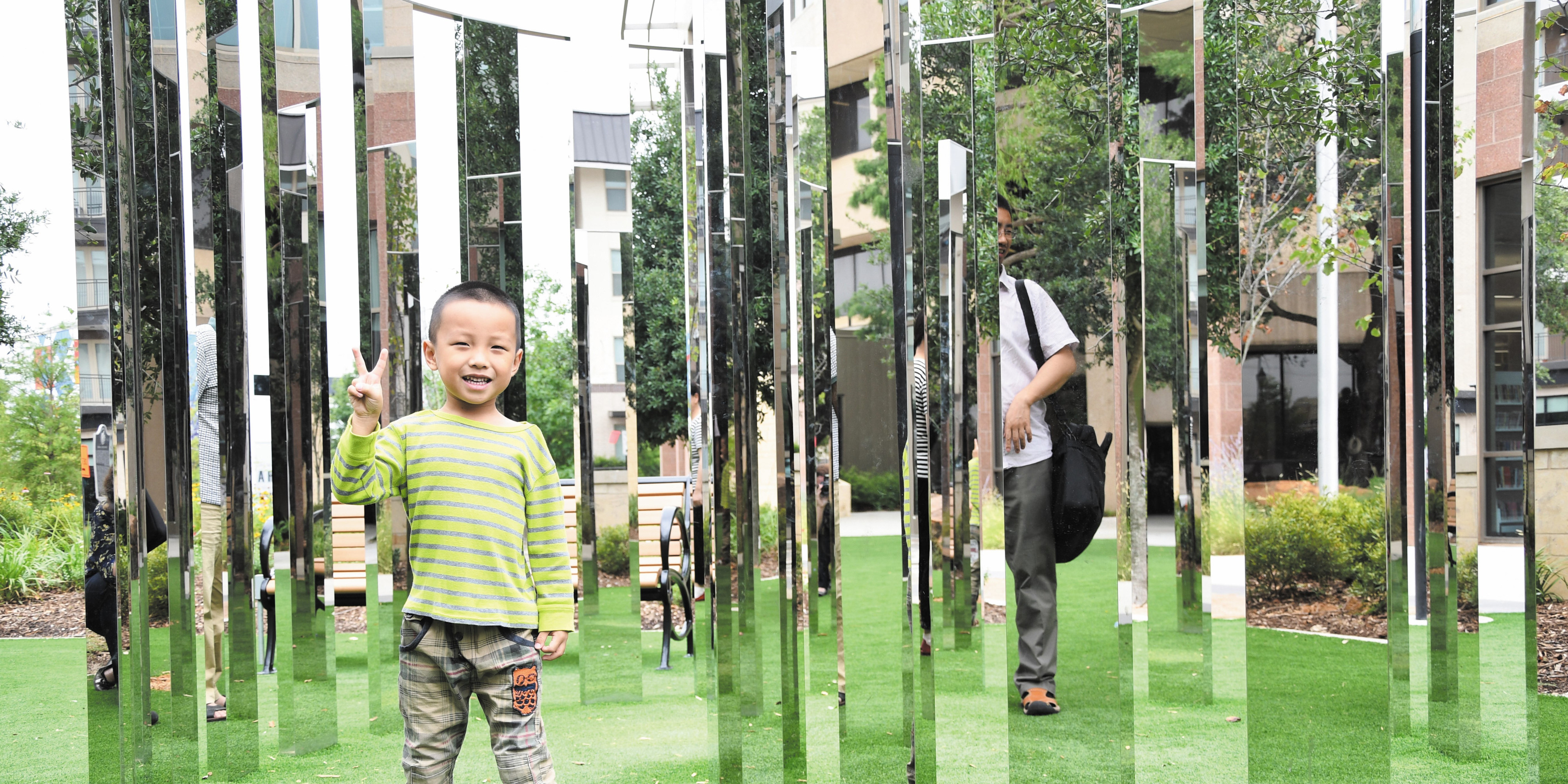 boy smiling in art structure