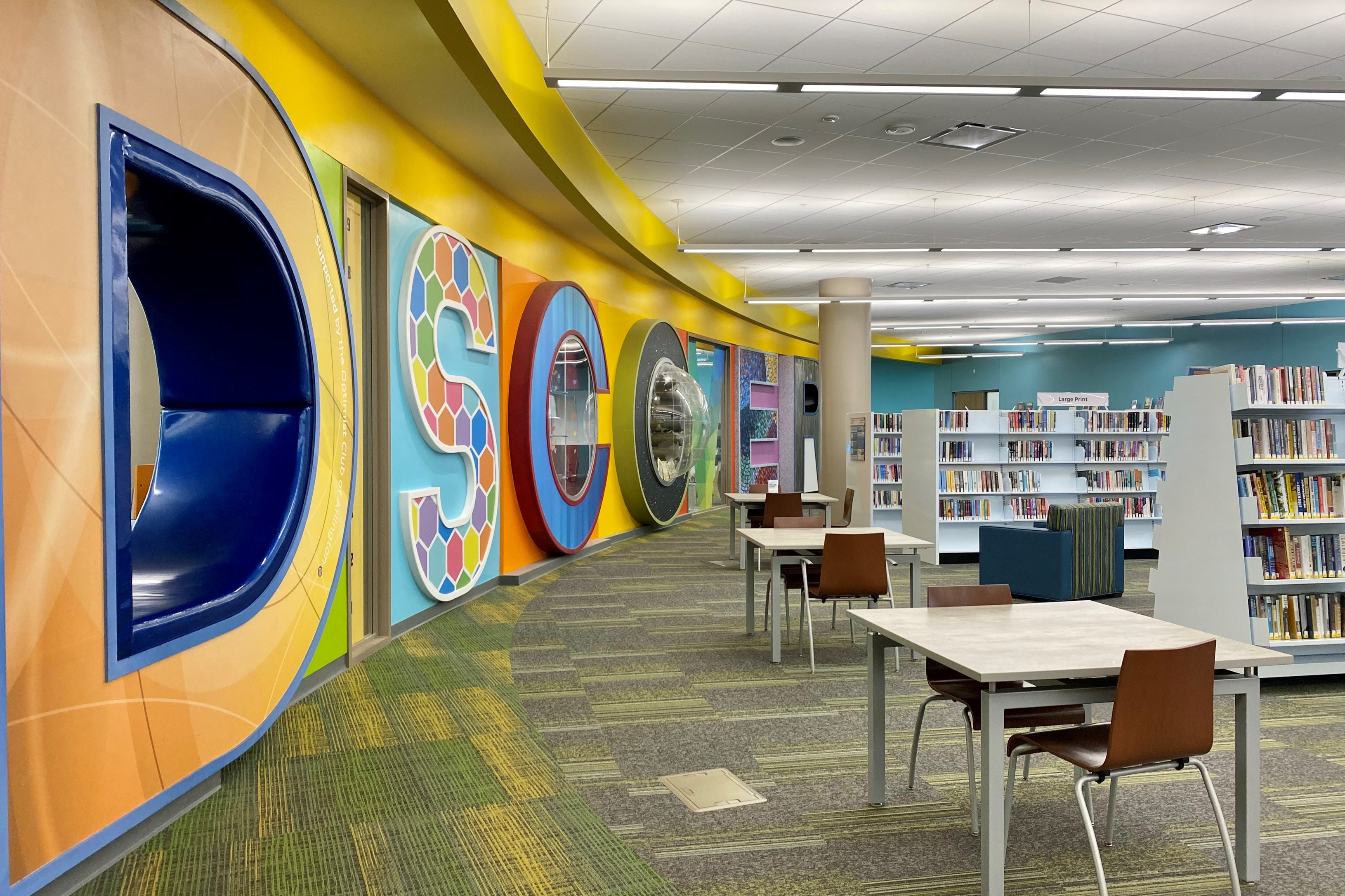 Library interior with colorful wall spelling out