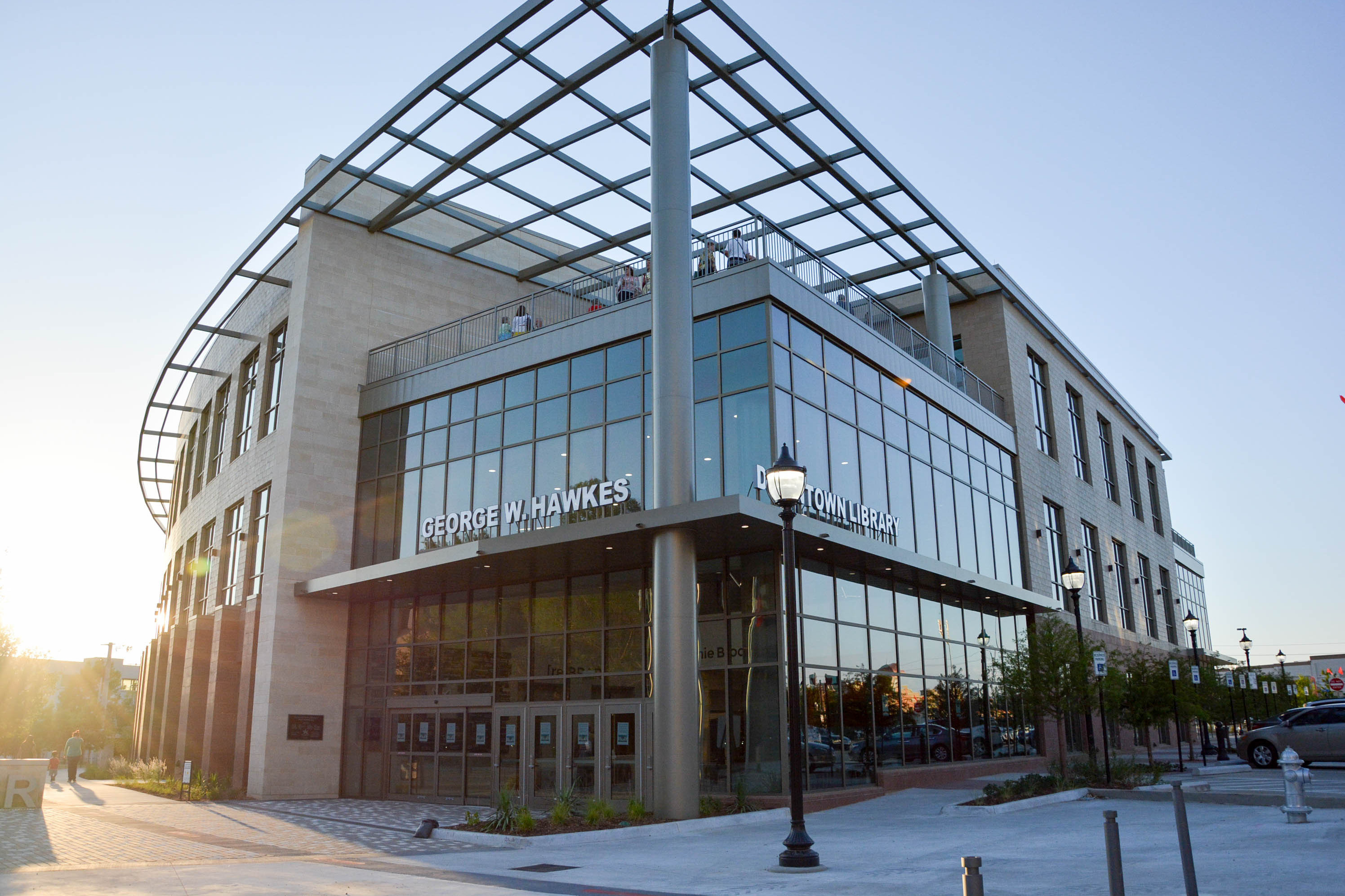 Exterior of modern steel and glass building with words 'George W. Hawkes Downtown Library'